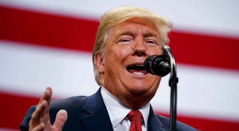In this Oct. 4, 2018 photo, President Donald Trump speaks during a campaign rally at the Mayo Civic Center in Rochester, Minn. (AP Photo/Evan Vucci)