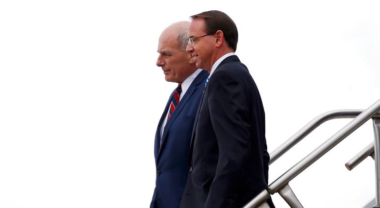 White House Chief of Staff John Kelly and Deputy Attorney General Rod Rosenstein step off Air Force One, Monday, Oct. 8, 2018, in Orlando, Fla. (AP Photo/Alex Brandon)