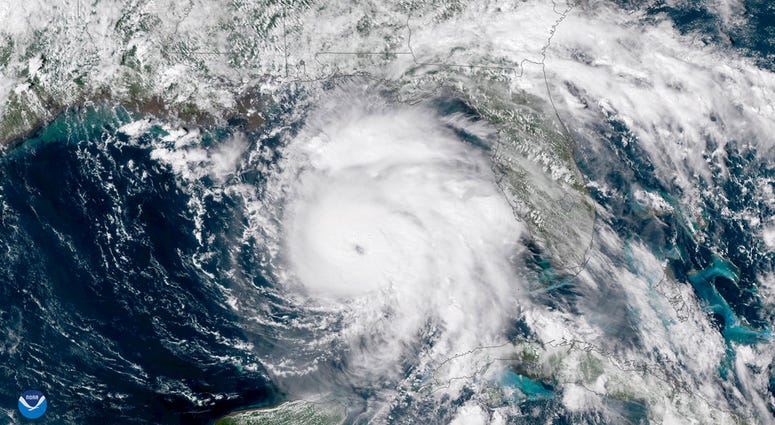 This Tuesday, Oct. 9, 2018 satellite image provided by NOAA shows Hurricane Michael, center, in the Gulf of Mexico. (NOAA via AP)