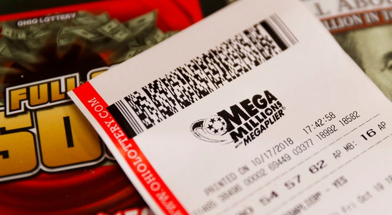 A Mega Millions lottery ticket rests on the shop counter at the Street Corner Market, Wednesday, Oct. 17, 2018, in Cincinnati.OH