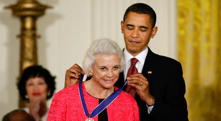 In this Aug. 12, 2009 file photo, President Barack Obama presents the 2009 Presidential Medal of Freedom to Sandra Day O'Connor. (AP Photo/J. Scott Applewhite)