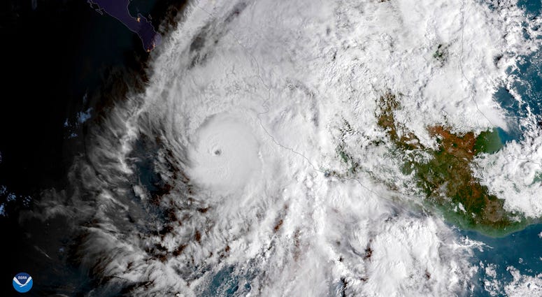This GOES East satellite image provided by NOAA shows Hurricane Willa in the eastern Pacific, on a path toward Mexico's Pacific coast on Monday, Oct. 22, 2018