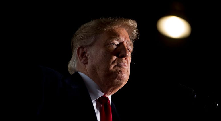 In this Oct. 27, 2018, file photo, President Donald Trump pauses while speaking at a rally at Southern Illinois Airport in Murphysboro, Ill. (AP Photo/Andrew Harnik, File)