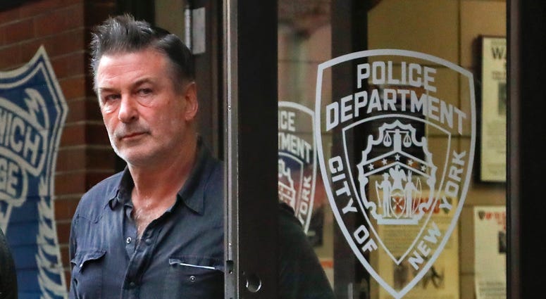 Actor Alec Baldwin walks out of the New York Police Department's 10th Precinct, Friday, Nov. 2, 2018, in New York