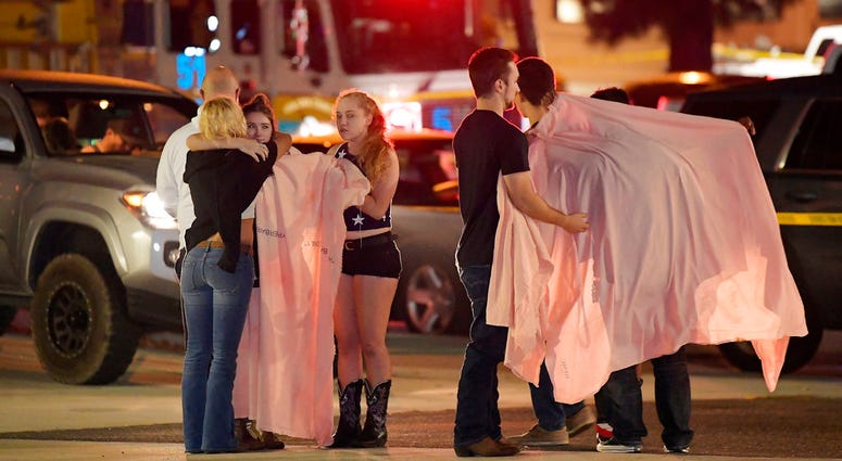 Shooting Survivors comfort each other