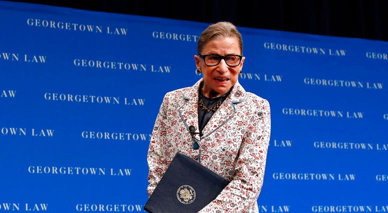 In this Sept. 26, 2018, file photo, Supreme Court Justice Ruth Bader Ginsburg leaves the stage after speaking to first-year students at Georgetown Law in Washington. (AP Photo/Jacquelyn Martin, File)