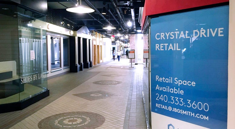In this Thursday, Nov. 8, 2018, photo, pedestrians walk the underground corridors in Crystal City, Va. (AP Photo/Matthew Barakat) In this Thursday, Nov. 8, 2018, photo, pedestrians walk the underground corridors in Crystal City, Va. (AP Photo/Matthew Barakat)