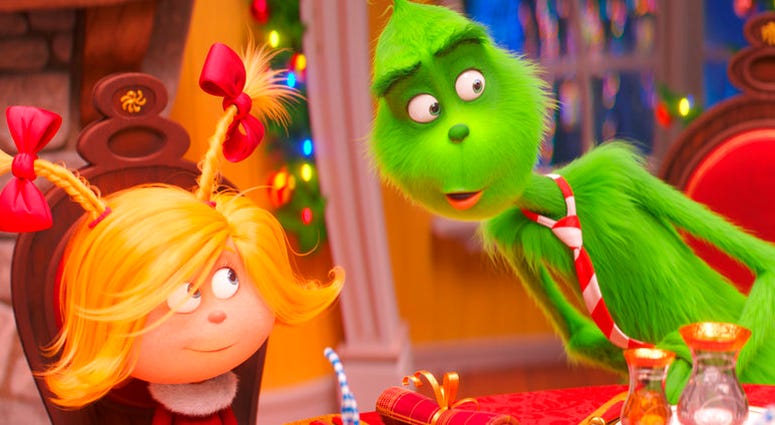 This file image released by Universal Pictures shows the characters Cindy-Lou Who, voiced by Cameron Seely, left, and Grinch, voiced by Benedict Cumberbatch, in a scene from "The Grinch."