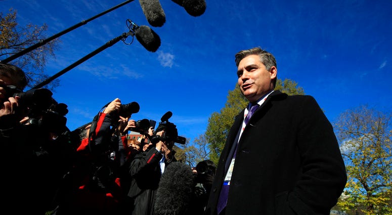 CNN's Jim Acosta speaks to journalists on the North Lawn upon returning back to the White House in Washington, Friday, Nov. 16, 2018. U.S. District Court Judge Timothy Kelly ordered the White House to immediately return Acosta’s credentials.