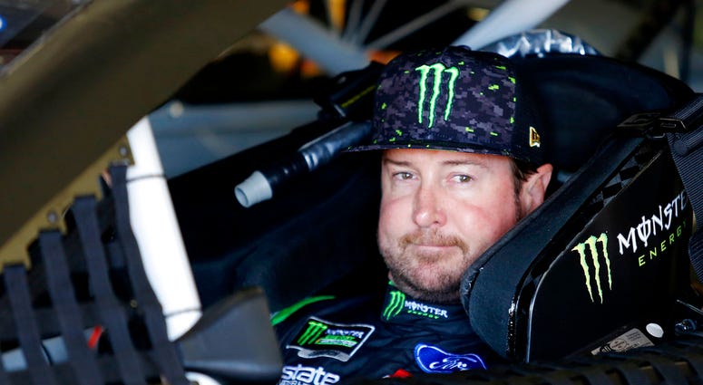 In this July 20, 2018, file photo, Kurt Busch waits in his car before NASCAR Cup Series auto racing practice at New Hampshire Motor Speedway in Loudon, N.H.