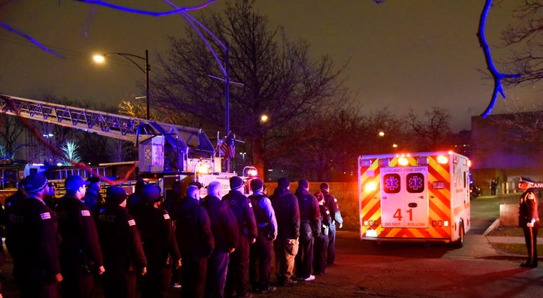 Law enforcement officers including Chicago SWAT work an entrance at Mercy Hospital Monday, Nov. 19, 2018, in Chicago. (AP Photo/Richard Drew, File) Law enforcement officers including Chicago SWAT work an entrance at Mercy Hospital Monday, Nov. 19, 2018, in Chicago. (AP Photo/Richard Drew, File)