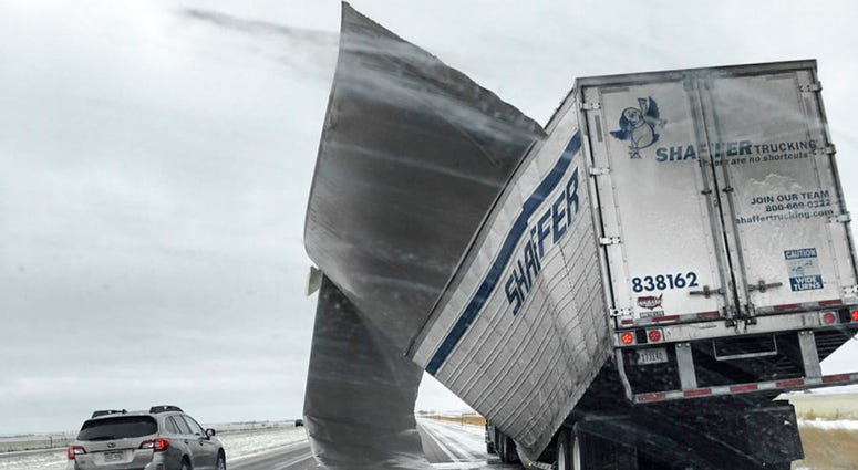 This Nov. 25, 2018 photo which was released by the Nebraska State Patrol, shows a broken up trailer amid blowing snow on Interstate 80 near Bradshaw, Neb.