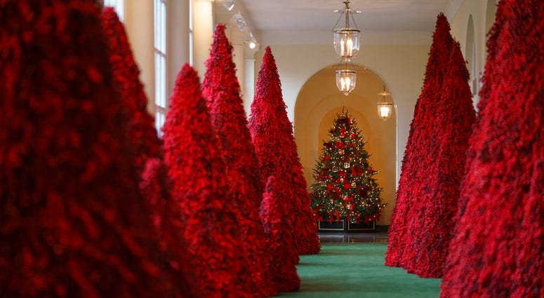 Topiary trees line the East colonnade during the 2018 Christmas Press Preview at the White House in Washington, Monday, Nov. 26, 2018.
