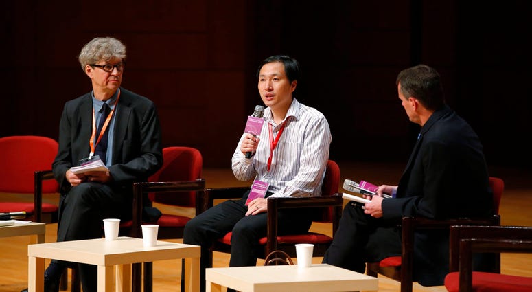 He Jiankui, a Chinese researcher, center, speaks during the Human Genome Editing Conference in Hong Kong, Wednesday, Nov. 28, 2018.(AP Photo/Kin Cheung) He Jiankui, a Chinese researcher, center, speaks during the Human Genome Editing Conference in Hong Kong, Wednesday, Nov. 28, 2018.(AP Photo/Kin Cheung)