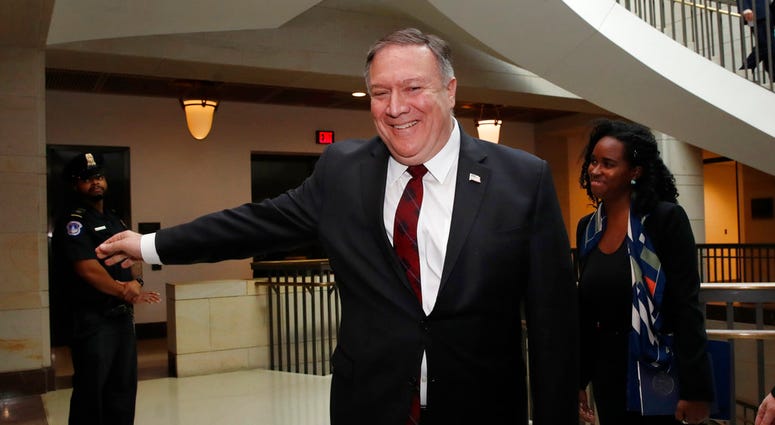 Secretary of State Mike Pompeo smiles after shaking hands with Sen. Cory Gardner, R-Colo., not shown, as Pompeo arrives for a closed door meeting with Senators about Saudi Arabia.(AP Photo/Jacquelyn Martin) Secretary of State Mike Pompeo smiles after shaking hands with Sen. Cory Gardner, R-Colo., not shown, as Pompeo arrives for a closed door meeting with Senators about Saudi Arabia.(AP Photo/Jacquelyn Martin)