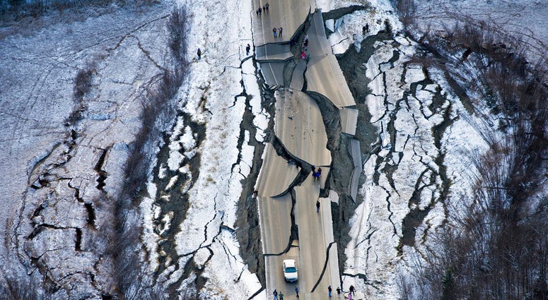 This aerial photo shows damage on Vine Road, south of Wasilla, Alaska, after earthquakes Friday, Nov. 30, 2018. (Marc Lester/Anchorage Daily News via AP) This aerial photo shows damage on Vine Road, south of Wasilla, Alaska, after earthquakes Friday, Nov. 30, 2018. (Marc Lester/Anchorage Daily News via AP)