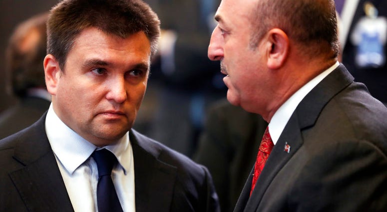 Turkish Foreign Minister Mevlut Cavusoglu, right, speaks with Ukraine's Foreign Minister Pavlo Klimkin. (AP Photo/Francisco Seco) Turkish Foreign Minister Mevlut Cavusoglu, right, speaks with Ukraine's Foreign Minister Pavlo Klimkin. (AP Photo/Francisco Seco)