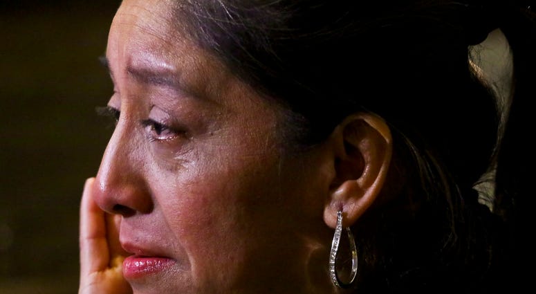 Victorina Morales becomes tearful during an interview, as she recalls "humiliating" treatment at the hands of a supervisor while working at President Donald Trump's golf resort in Bedminster, N.J., Friday Dec. 7, 2018,