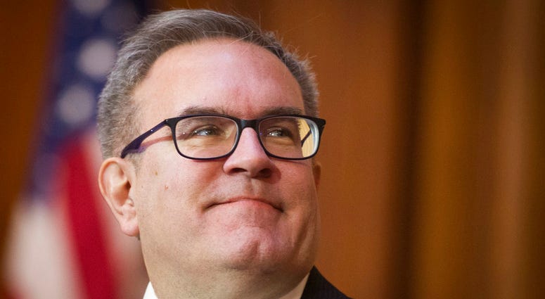 Acting EPA Administrator Andrew Wheeler signs an order withdrawing federal protections for countless waterways and wetland, at EPA headquarters in Washington, Tuesday, Dec. 11, 2018.