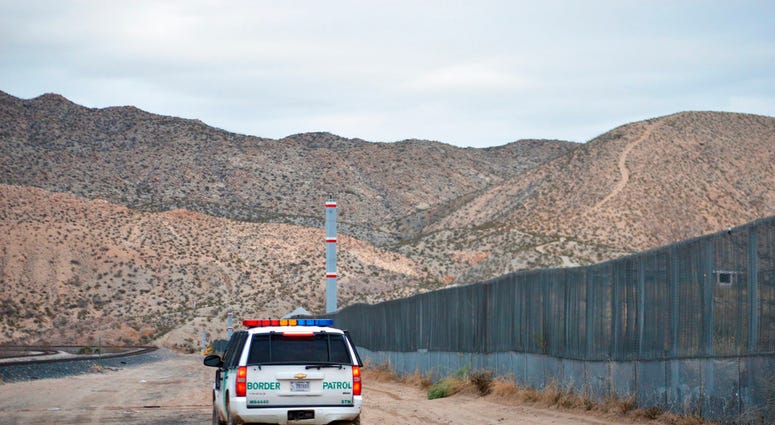 In this Jan. 4, 2016, file photo, a U.S. Border Patrol agent patrols Sunland Park along the U.S.-Mexico border next to Ciudad Juarez. (AP Photo/Russell Contreras, File)