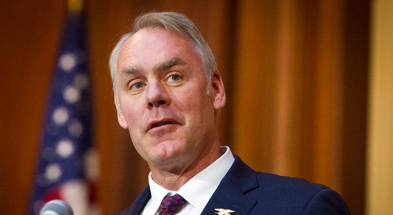 In this Dec. 11, 2018 file photo, Secretary of the Interior Ryan Zinke speaks after an order withdrawing federal protections for countless waterways and wetland was signed, at EPA headquarters in Washington.