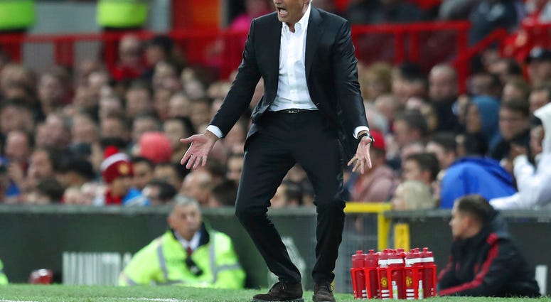 In this Friday, Aug. 10, 2018 file photo Manchester United's manager Jose Mourinho reacts in frustration during the English Premier League soccer match between Manchester United and Leicester City at Old Trafford, in Manchester, England.