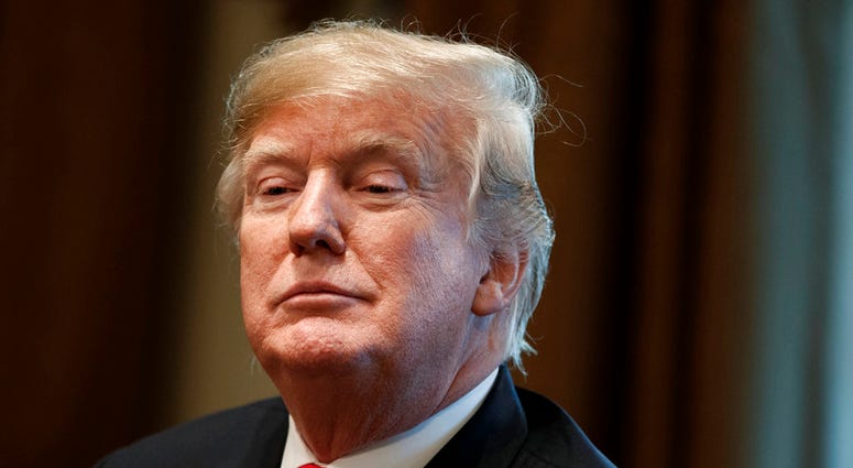 In this Dec. 13, 2018, file photo, President Donald Trump listens during a meeting in the Cabinet Room of the White House in Washington.