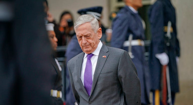 In this Nov. 9, 2018, file photo, Defense Secretary Jim Mattis waits outside the Pentagon.