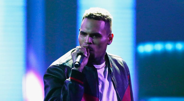 n this June 25, 2017, file photo, Chris Brown performs at the BET Awards at the Microsoft Theater in Los Angeles.