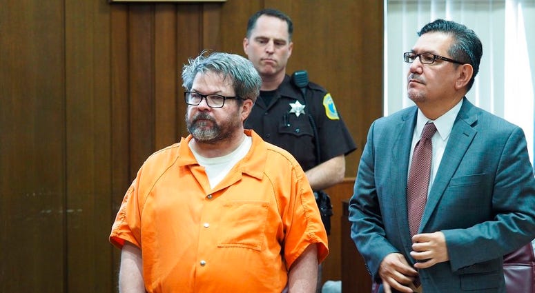 In this April 20, 2017 file photo, defendant Jason Dalton, left, who is charged with killing six people in-between picking up riders for Uber, stands with attorney Eusebio Solis during a hearing in Kalamazoo, Mich