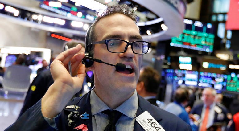 Trader Gregory Rowe works on the floor of the New York Stock Exchange, Friday, Jan. 4, 2019. (AP Photo/Richard Drew)