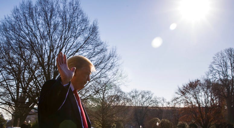 President Donald Trump waves as he departs after speaking on the South Lawn of the White House as he walks to Marine One, Sunday, Jan. 6, 2019. (AP Photo/Alex Brandon)