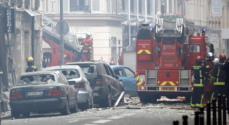 Firefighters work at the scene of a gas leak explosion in Paris, France, Saturday, Jan. 12, 2019. Paris police say several people have been injured in an explosion and fire at a bakery believed caused by a gas leak