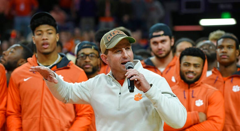 Clemson head football coach Dabo Swinney along with members of the 2019 National Championship football team Jan.12, 2019, in Clemson, S.C