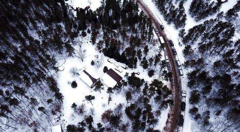 This aerial photo shows the cabin where 13-year-old Jayme Closs was held by Jake Thomas Patterson, is surrounded by law enforcement vehicles, Saturday, Jan. 12, 2019 in the town Gordon, Wis.