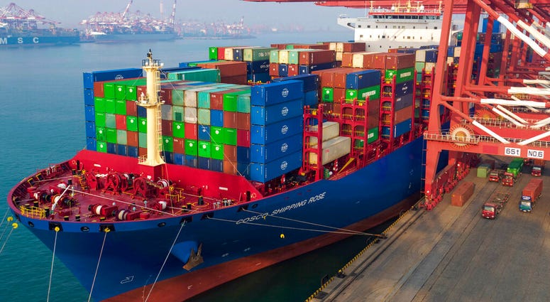 In this Friday, Jan. 11, 2019, photo, workers moor a container ship at a port in Qingdao in east China's Shandong province. (Chinatopix via AP) In this Friday, Jan. 11, 2019, photo, workers moor a container ship at a port in Qingdao in east China's Shandong province. (Chinatopix via AP)
