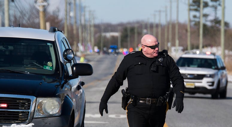 Officials respond to reports of an active shooter at a UPS facility Monday, Jan. 14, 2019 in Logan Township, N.J.