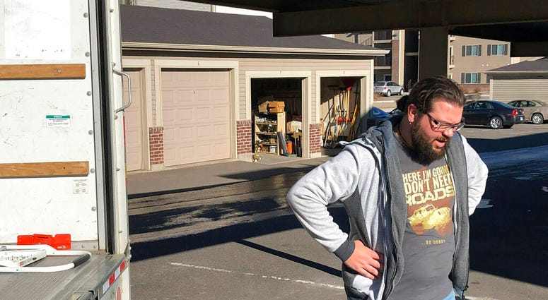 George Jankowski, a furloughed U.S. Department of Agriculture worker, helps a friend move out of an apartment in Cheyenne, Wyo., Monday, Jan. 14, 2019. (AP Photo/Mead Gruver) George Jankowski, a furloughed U.S. Department of Agriculture worker, helps a friend move out of an apartment in Cheyenne, Wyo., Monday, Jan. 14, 2019. (AP Photo/Mead Gruver)