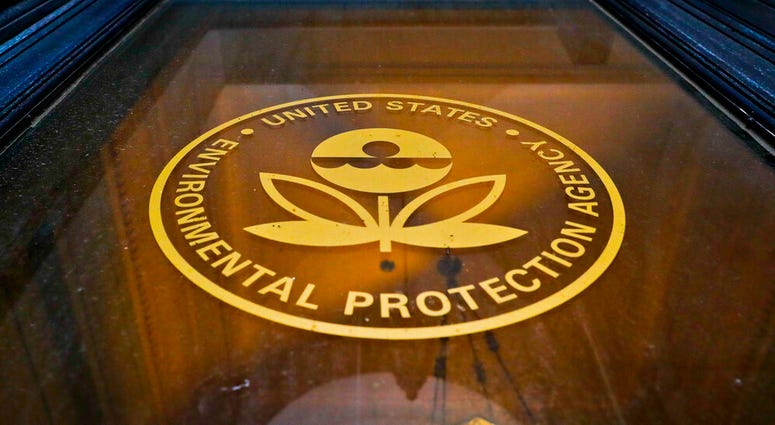n this Sept. 21, 2017, file photo, a sign on a door of the Environmental Protection Agency in Washington.