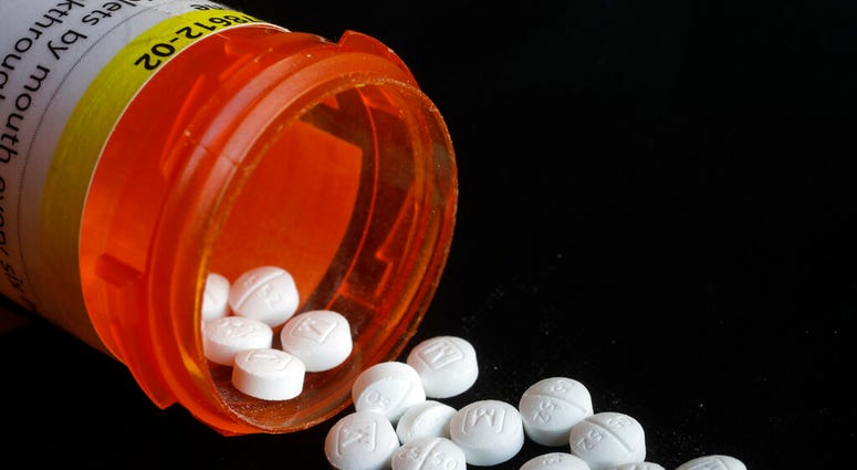 FILE - This Aug. 29, 2018 photo shows an arrangement of prescription Oxycodone pills in New York. (AP Photo/Mark Lennihan) FILE - This Aug. 29, 2018 photo shows an arrangement of prescription Oxycodone pills in New York. (AP Photo/Mark Lennihan)