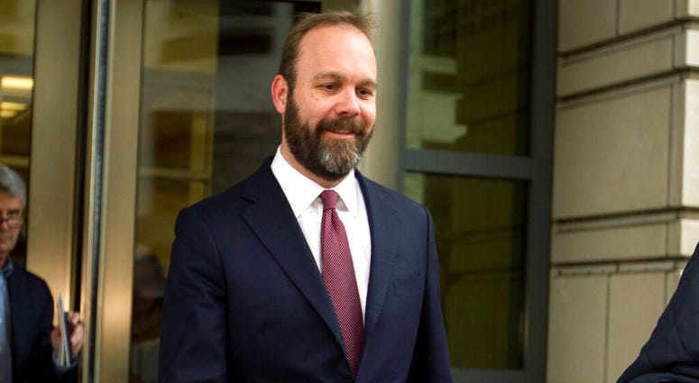 FILE - In this Feb. 23, 2018 file photo, Rick Gates leaves federal court in Washington. (AP Photo/Jose Luis Magana) FILE - In this Feb. 23, 2018 file photo, Rick Gates leaves federal court in Washington. (AP Photo/Jose Luis Magana)