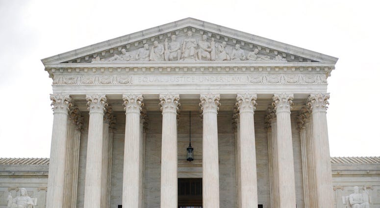 In this Oct. 9, 2018 photo, police office guards the main entrance to the Supreme Court in Washington. (AP Photo/Pablo Martinez Monsivais) In this Oct. 9, 2018 photo, police office guards the main entrance to the Supreme Court in Washington. (AP Photo/Pablo Martinez Monsivais)