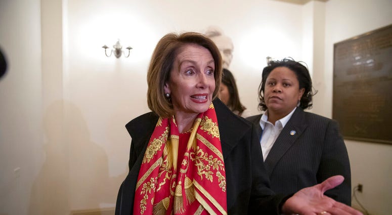 Speaker of the House Nancy Pelosi, D-Calif., responds to reporters after officially postponing President Donald Trump's State of the Union address until the government is fully reopened. (AP Photo/J. Scott Applewhite)