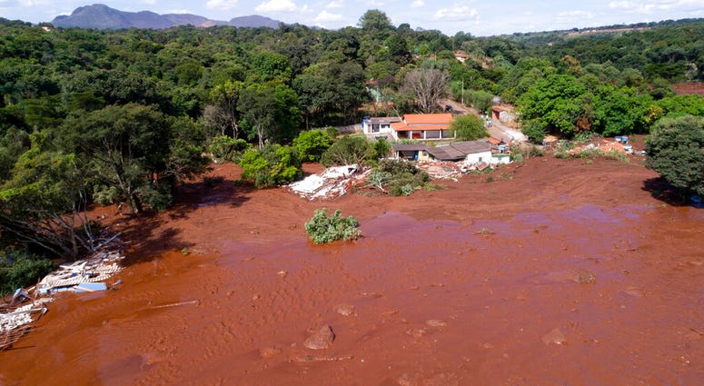 An aerial view shows flooding triggered by a collapsed dam near Brumadinho, Brazil, Friday, Jan. 25, 2019.