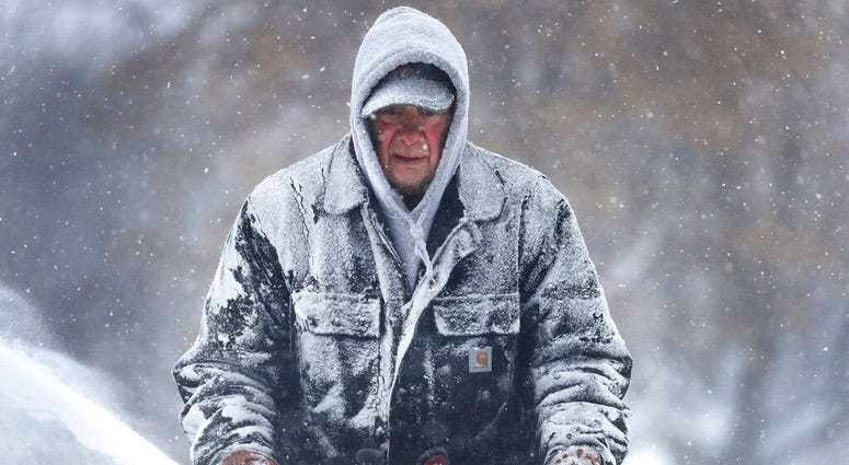 Wisconsin man with snowblower