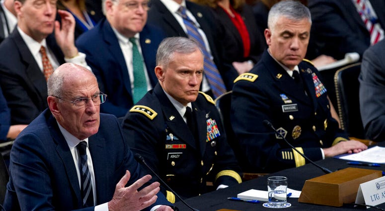 Director of National Intelligence Daniel Coats, left, accompanied by Defense Intelligence Agency Director Gen. Robert Ashley and National Security Agency Director Gen. Paul Nakasone testify before the Senate Intelligence Committee in Washington