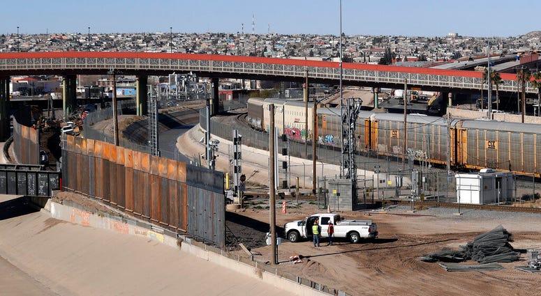 In this Tuesday, Jan. 22, 2019, photo, a new barrier is built along the Texas-Mexico border near downtown El Paso. (AP Photo/Eric Gay)