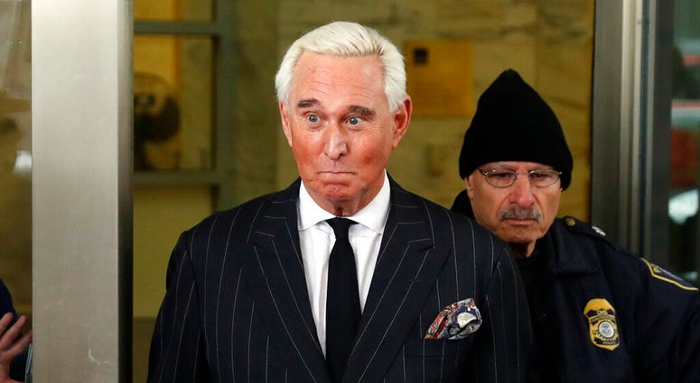 FILE - In this Feb. 1, 2019, file photo, former campaign adviser for President Donald Trump, Roger Stone, leaves federal court in Washington. President Donald Trump's longtime confidant Stone has apologized to the judge presiding over his criminal case fo