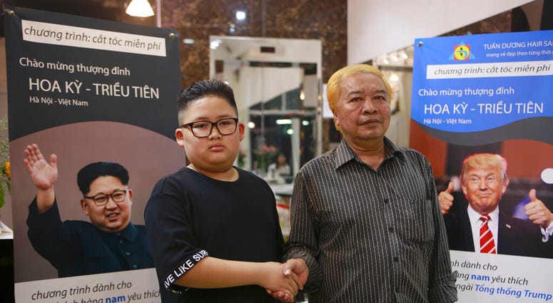 Two men sporting Jim & Trump haircuts
