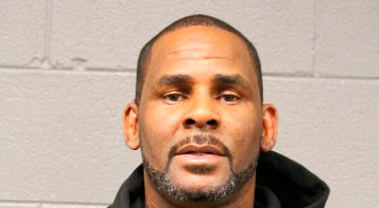 In this photo taken and released by the Chicago Police Dept., Friday, Feb. 22, 2019, R&B singer R. Kelly is photographed during booking at a police station in Chicago, Il. (Chicago Police Dept. via AP)